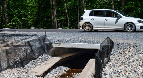 car driving over ecopassage